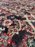 Vintage rug with intricate design and even wool pile