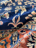 Close up of high sheen wool on a 1920s Persian Sarouk rug.