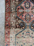 Vintage Persian runner with figures, animals, and hand-woven tribal art details.