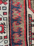 Close up of one of a kind Persian Serab runner with unique geometric patterns.

