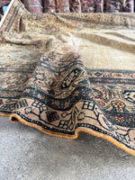 Antique rug in soft, vegetable-dyed color palette