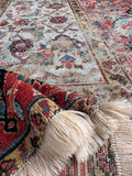Detailed view of antique Persian runner showing the fine hand-knotted wool texture and natural dye variations.