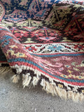Shabby chic Persian runner with soft wool pile and raw wool fringes.