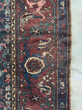 Handwoven 1920s Malayer rug with a slate gray blue edge guard and tribal design.