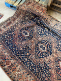 Antique Persian Shiraz rug subtly woven with tribal motifs.