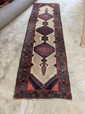 Skinny Persian runner under 3 feet wide in red, blue, and ivory.