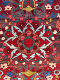 Fine knot wool area rug displaying authentic vegetable dye saturation and depth.