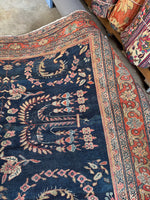 Slimmer-than-usual main border framing the rug.