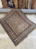 Small scale antique Caucasian rug with all over design and low wool pile.