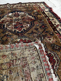 Small vintage Caucasian rug with two stacked medallions