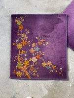 Full view of small antique Chinese Art Deco rug with purple background.