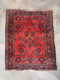 Vintage Persian scatter rug with vegetable dyed coral wool and intricate floral pattern.