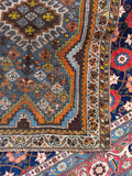 Small antique Persian rug circa 1920 with low pile and authentic worn character.
