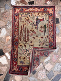Low pile distressed Tabriz pictorial illustrating natural distress, aged wool, and fine knotting.