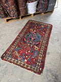 Small Persian rug ideal for entryway or compact spaces.