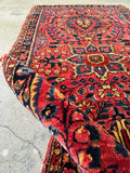 Durable vintage Persian wool rug showing its stout construction and healthy pile.