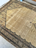 Restored Persian rug with low pile and visible age