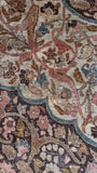 Close-up of a 1920s vintage Persian Tabriz area rug.