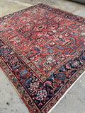 Square Heriz rug all over tribal geometric pattern.