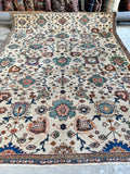 Floor-ready antique rug with vibrant colors and intact integrity.