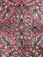 Heavy duty floral Sarouk rug with balanced design.