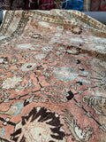 Tabriz rug with bird motifs in the field.