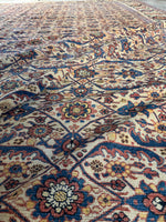 Close-up of floral lattice pattern against ivory background.