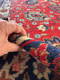 Low-pile antique Persian rug with tight weave and lasting durability.