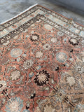 Persian Tabriz rug with interlaced floral pattern.