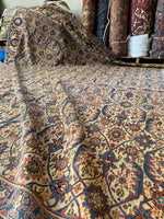 Close-up of a patterned rug with intricate designs.