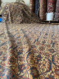 Close-up of a patterned rug with intricate designs.