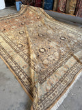 Antique Tabriz rug with bird and floral lattice design.