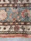 Antique Tabriz rug with soft blue bird border.