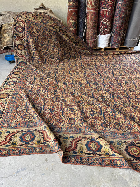 One end of antique Persian Tabriz rug with folds.