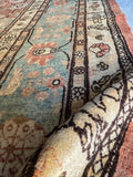Antique Tabriz rug botanical border close up.