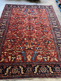 Antique Persian rug, 8x11, featuring Heriz-inspired tribal layout.
