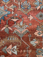 Persian rug in walnut, pistachio, and baby blue hues