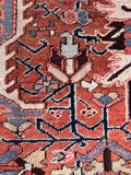 Edgy rectilinear design Persian rug detailed view focusing on intricate geometric symbols, angular medallions, and stylized floral motifs.