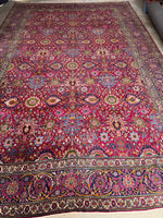 Handwoven Persian rug showcasing vivid botanical designs