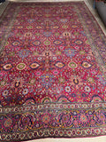 Handwoven Persian rug showcasing vivid botanical designs