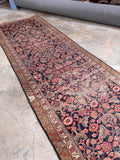 Early 1900s shabby chic Persian rug detail highlighting the rich vegetable-dyed wool and intricate floral motifs.