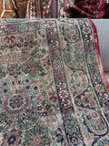 Antique Persian accent rug woven with fine tightly spun wool and curvilinear artwork.