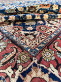 Antique Persian Veramin carpet displaying color palette and wool texture.