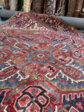 9x12 antique Persian area rug, authentic Heriz rug with architectural rectilinear design and central medallion.