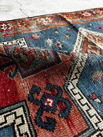 Aged palette Caucasian rug with vegetable dyed wool.