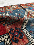 Aged palette Caucasian rug with vegetable dyed wool.