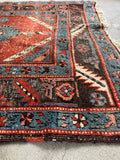 Handmade Caucasian hallway runner featuring bold tribal medallions and vegetable-dyed wool.