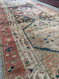 Close-up view of eight medallion Persian runner with brown, blush, and ivory tones.