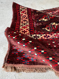 Antique Persian bag face textile with rich lanolin luster, ideal for a floor accent or custom lumbar pillow.