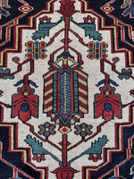 Close-up of tribal medallion with surrounding vines.